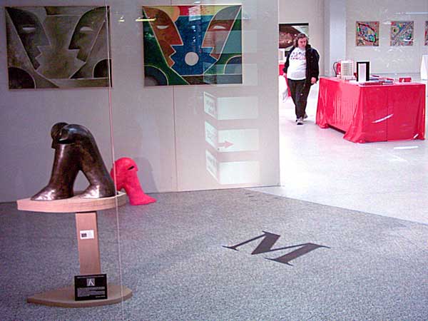 Sculpture "ren" in front of the  paintings "Dialog"
